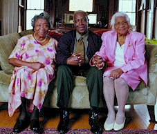 Three seniors sitting on a couch
